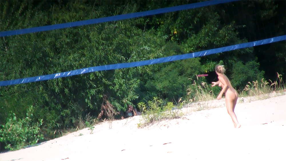 Playing and Lounging Among Nudists at a Beach Bar