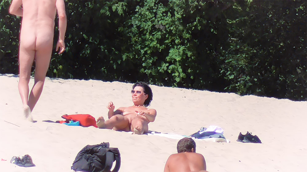 Sitting on the Sand at a Nude Beach with a Red Bag