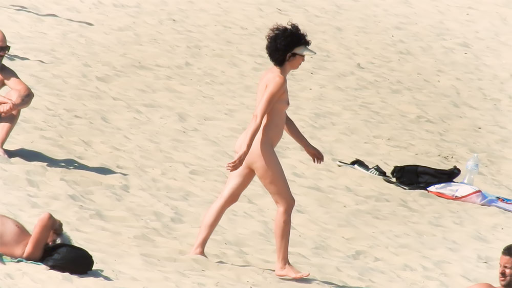 White Visor and Sandy Shoreline on a Quiet Nudist Beach