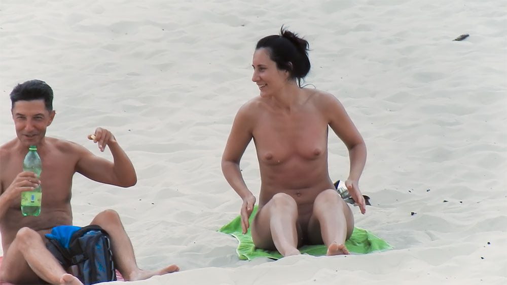 Kneeling on a Green Towel at a Nude Beach