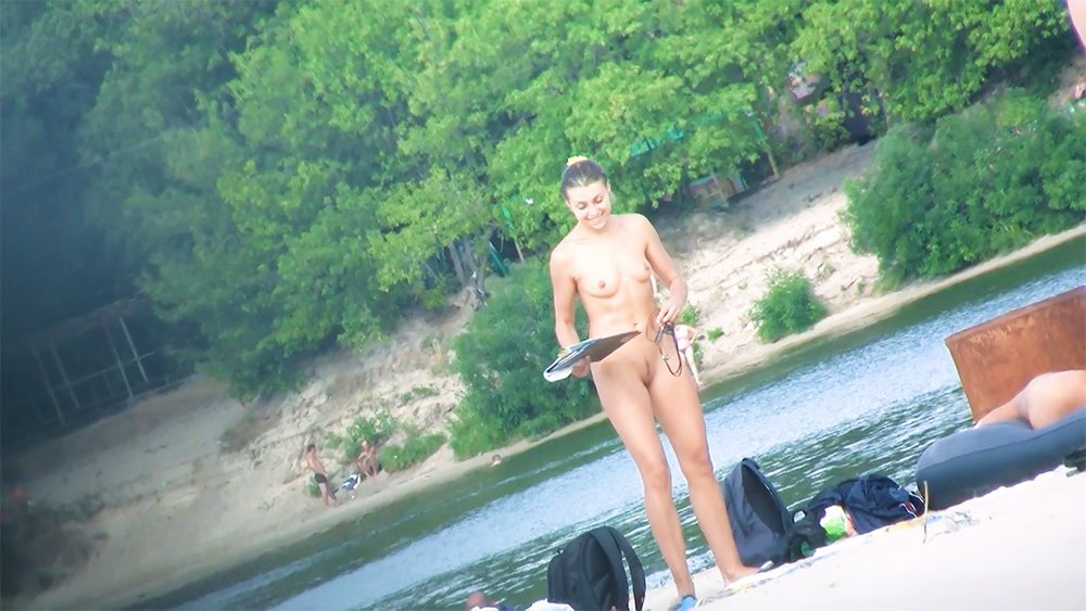 Adorable teen nudist caught on a hidden camera