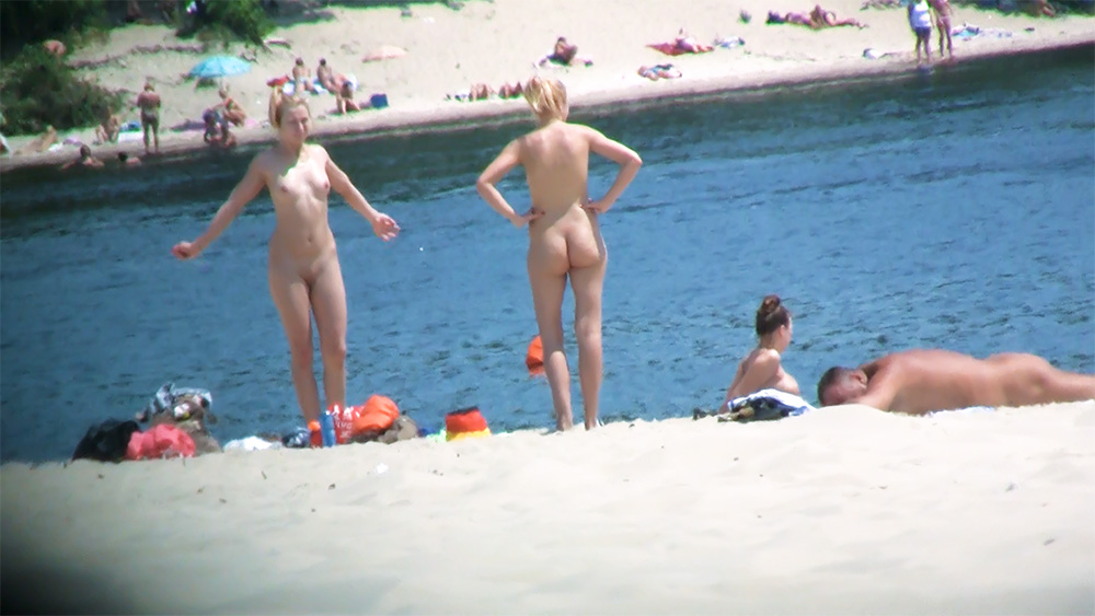 Bombastic nude beach girl enjoys a beautiful sunny day