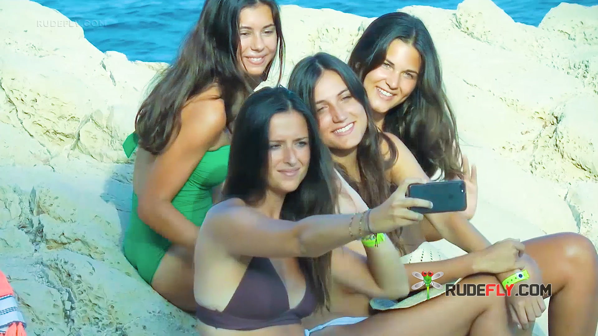 Four Women Taking a Selfie on the Beach