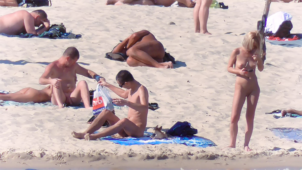 One Woman at the Nude Beach Holding Bikini Bottoms