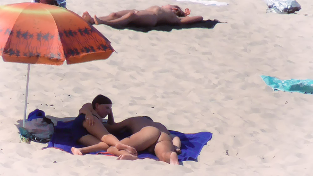 Curvy nude beach girl enjoys her day