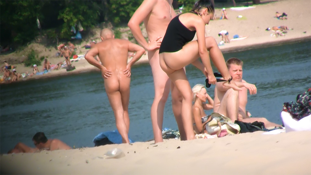 Skinny young nudist enjoys putting her amazing body on display