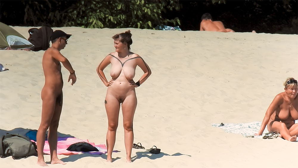 My chick friend sunbathing nude on a beach of ., Well, take a guess.