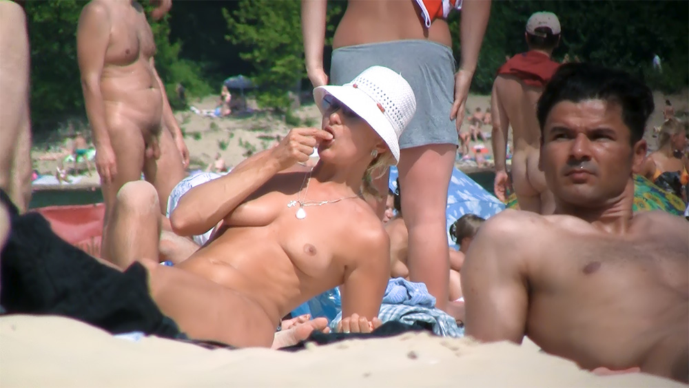 White Sun Hat and Pendant on a Quiet Nude Beach