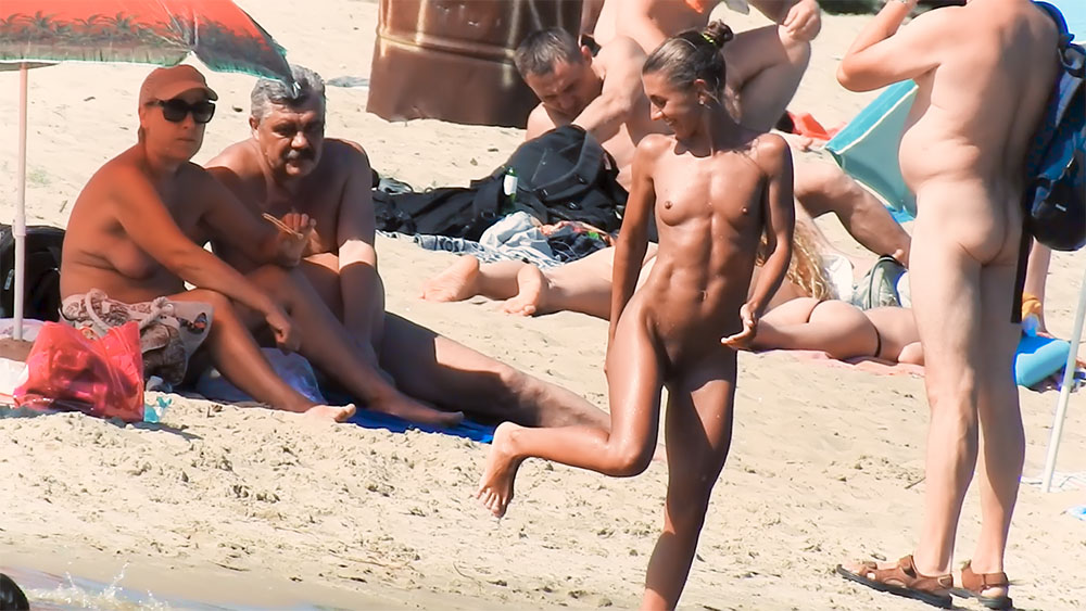 My wife is very exhibitionist loves to get naked on the plage for the enjoyment of swimmers and her husband photographing his muse. 2