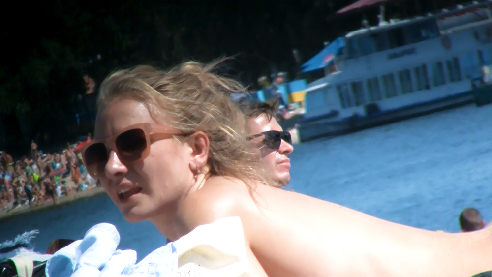 Two Adults on a Sunny Riverside Boat Ride