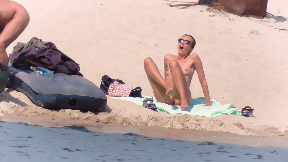 One Nude Beach Sunbather Sitting with Knees Raised