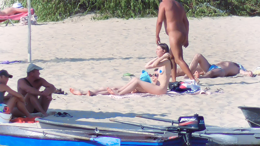 Sitting Topless on a Towel at the Topless Beach