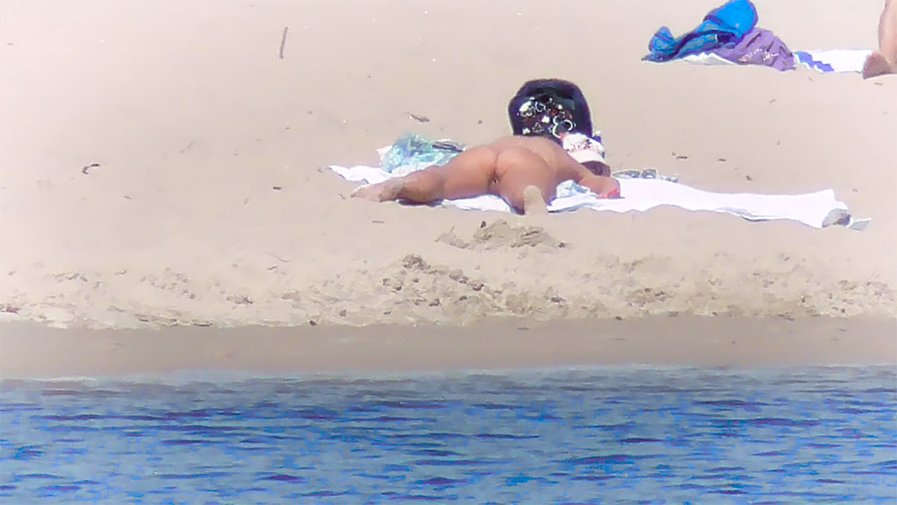Nude beach girl filmed enjoying a sunny day at the beach 4