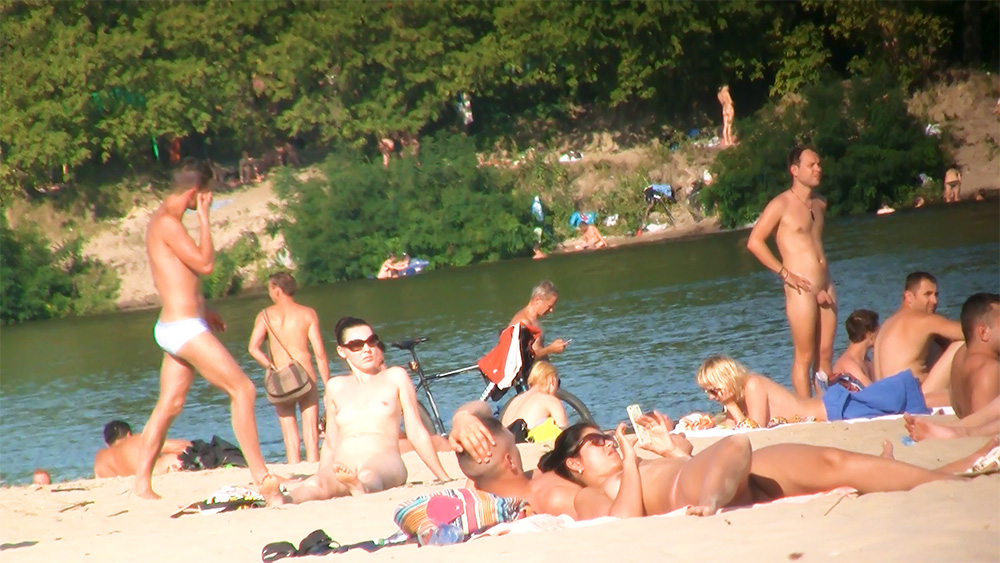 Young nudist enjoys her time on the beach