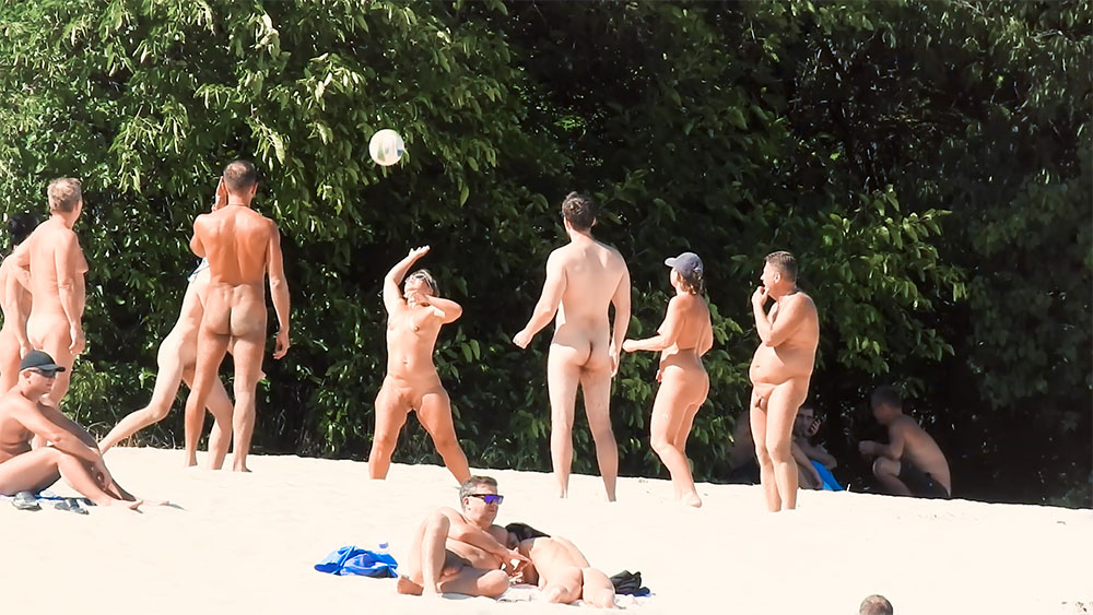 Five Nudists in a Beach Volleyball Game by the Trees