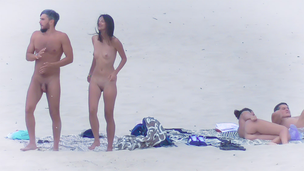A nice teen with nice boobs on a beach : first time under the sun ?