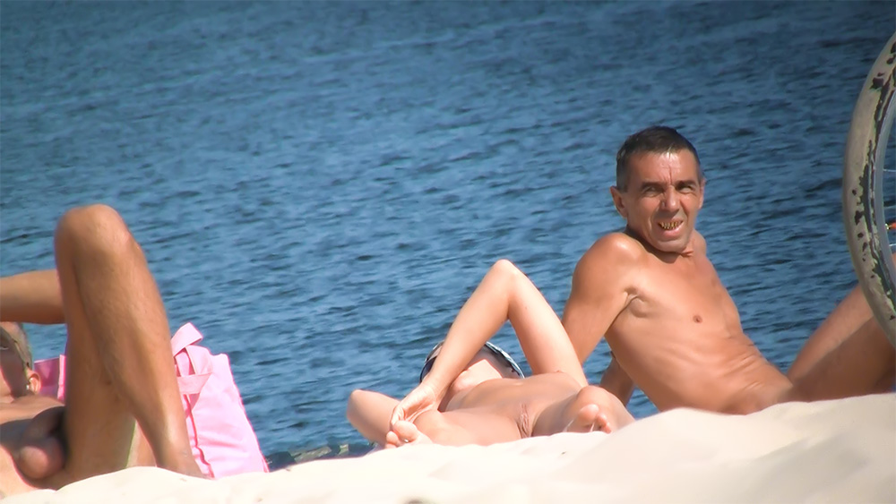 She poses and teases before being photographed with her perky tits and smooth, shaved pussy showing.