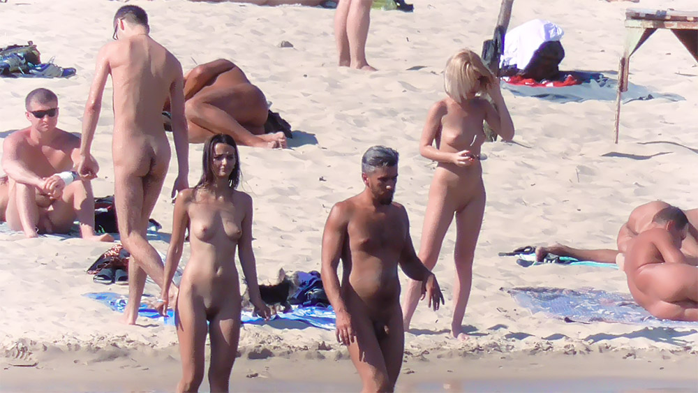 Five Nudists Gathered on the Open Sand