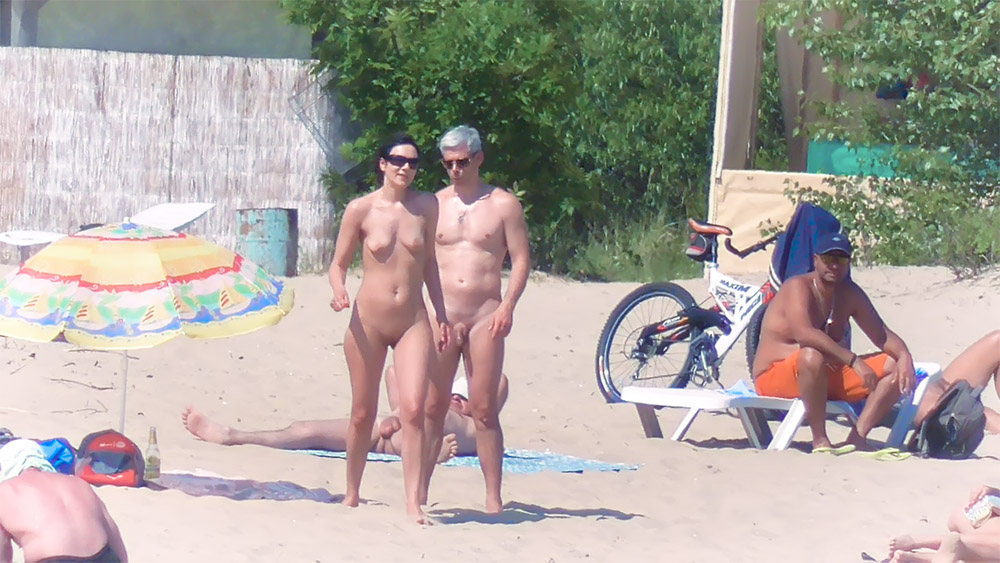 Nude Beach Couple Posing on Sand by a Bicycle