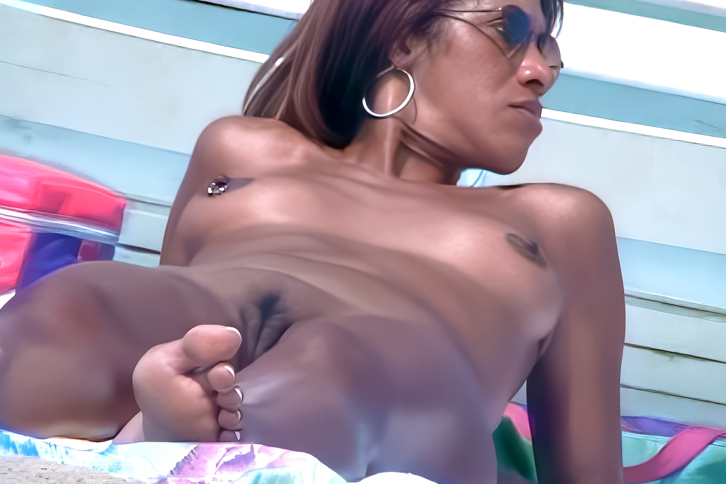 Simple nudist relaxation beside ocean at Haulover Nude Beach