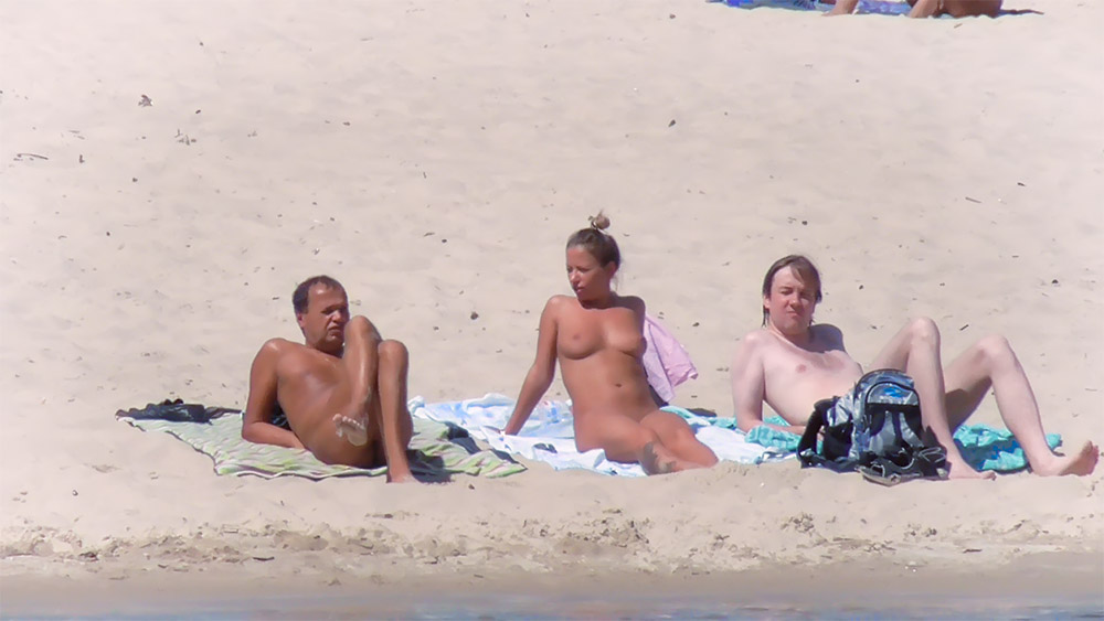 A stunning nudist teen with a killer body caught on voyeur cam naked at the beach 3
