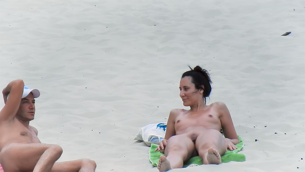 Sitting on a Green Towel at a Nude Beach