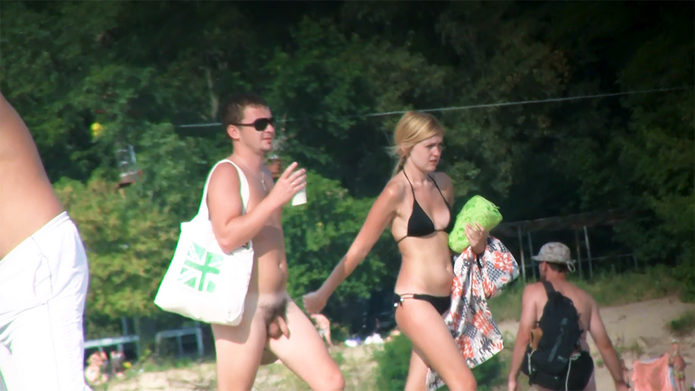 Four Naturists Walking and Posing by a Lakeside Beach