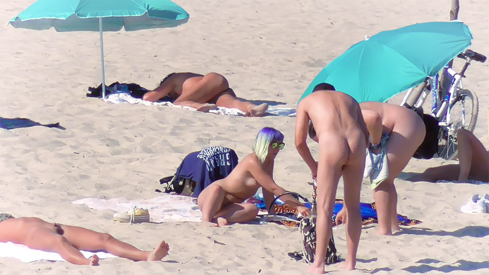 Kneeling on a Beach Towel at a Nude Beach