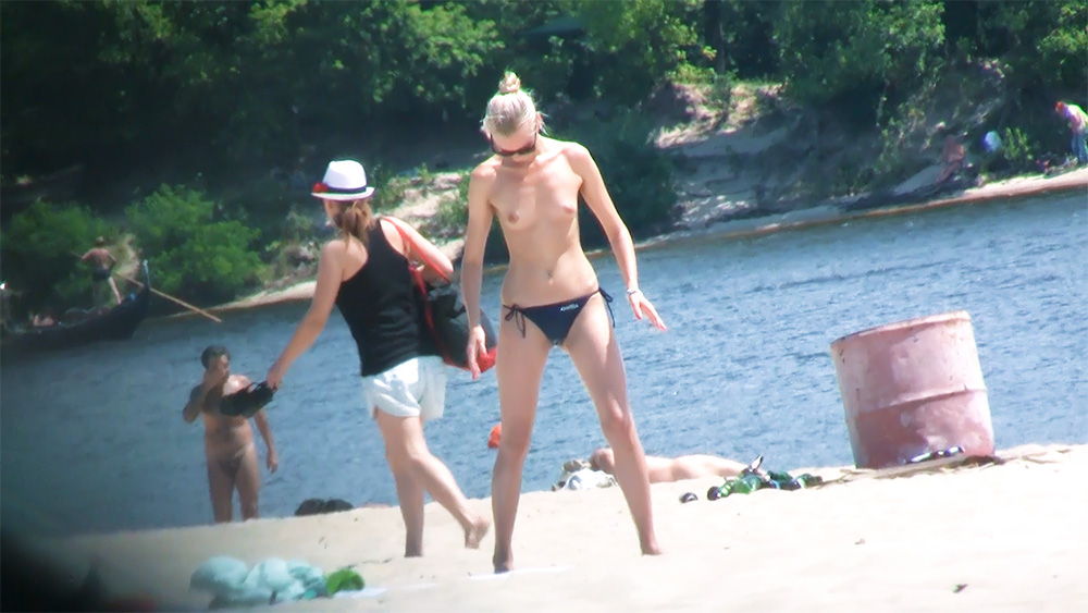 Standing on a Riverside Topless Beach in Navy Bottoms