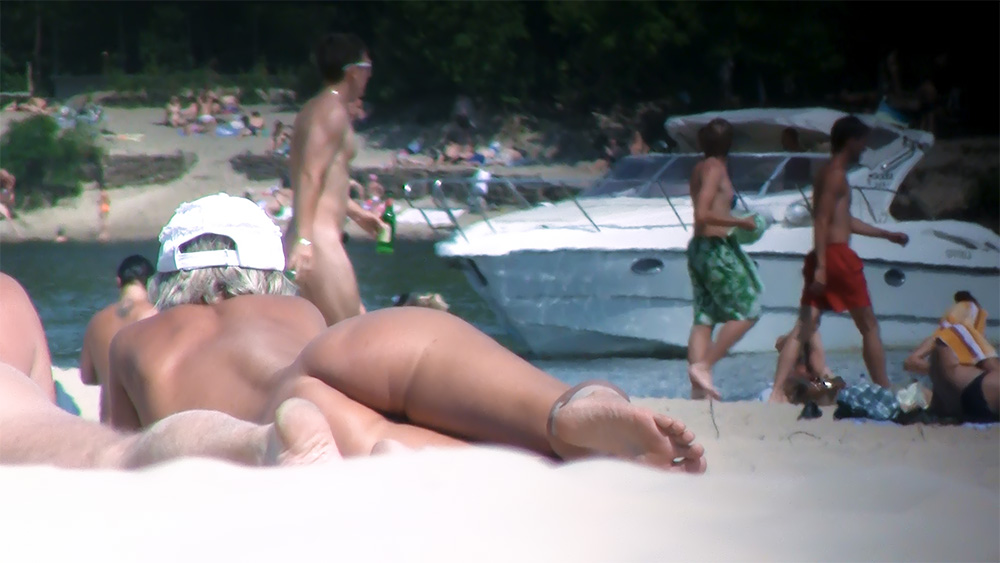 A few "behind" shots of my wife on  the beach and one wading in a stream last august.